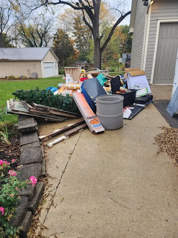 Dumpster being loaded with debris for Residential Dumpster Rental in Sage